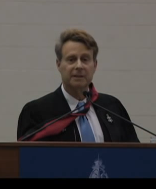 An image of Mark Helprin in the podium